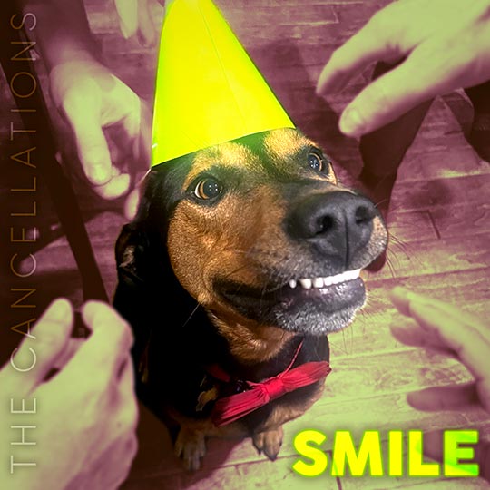The cover art for The Cancellations "Smile" - it is a smiling dog wearing a party hat and a bow tie, while several masculine hands reach for his face